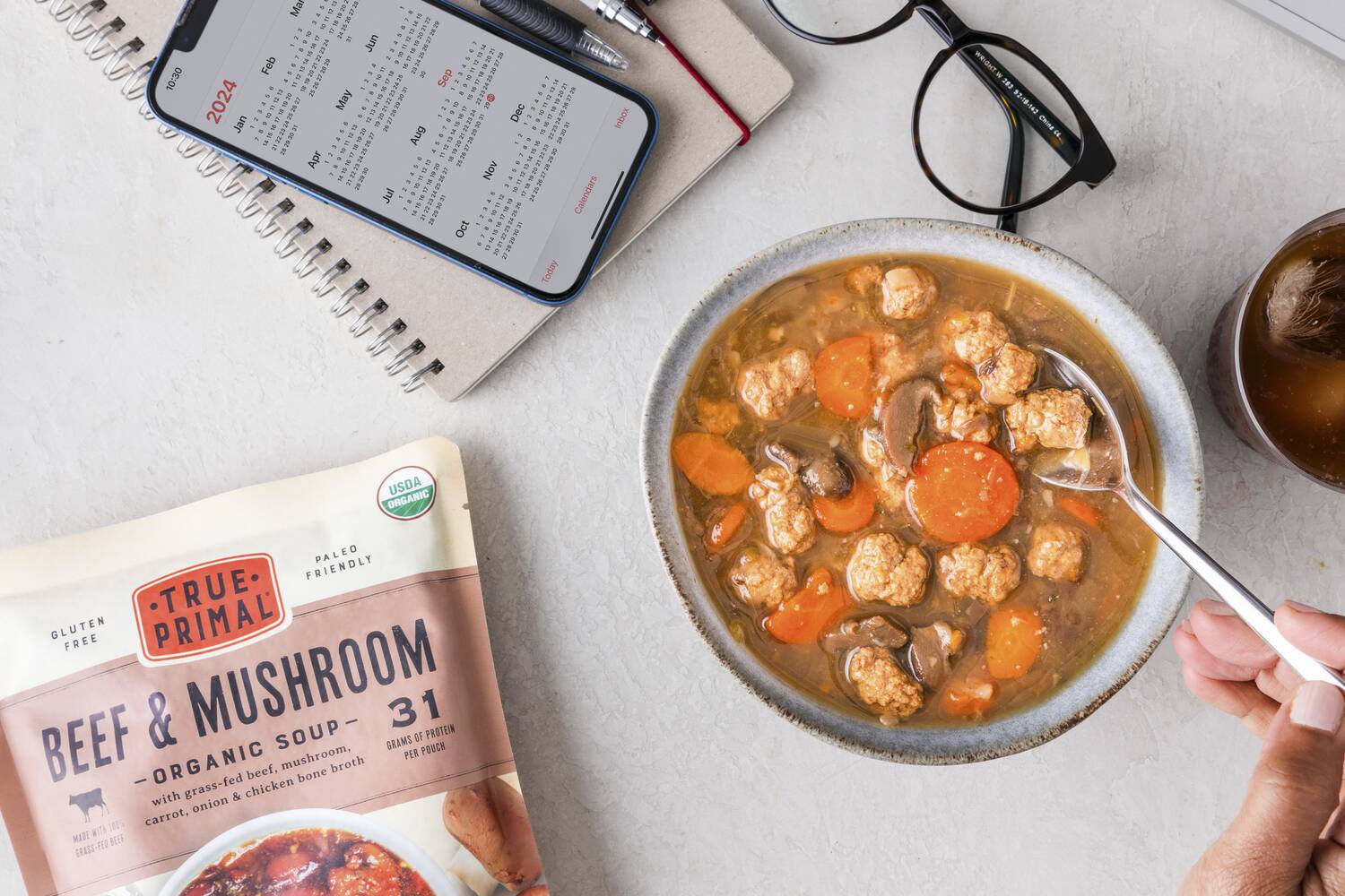 Beef and Mushroom Soup in bowl next to pouch and calendar