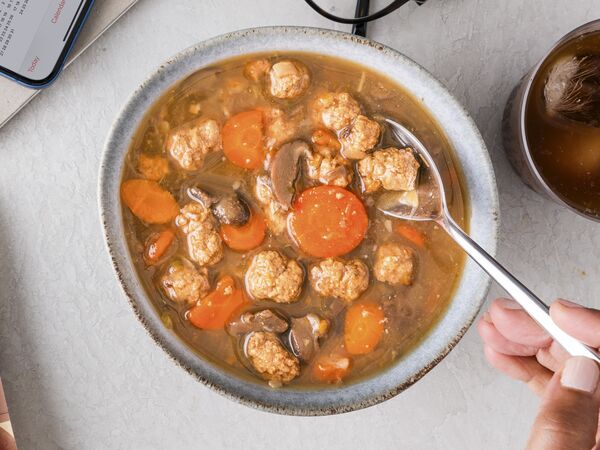 True Primal Beef & Mushroom Organic Soup in bowl with spoon