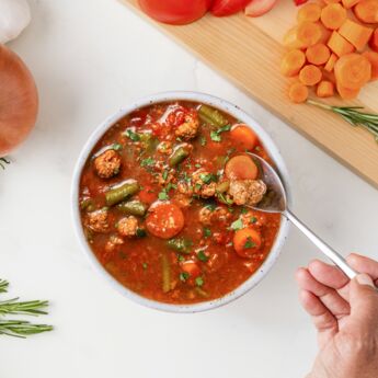 True Primal Beef & Vegetable Organic Soup in bowl with spoon