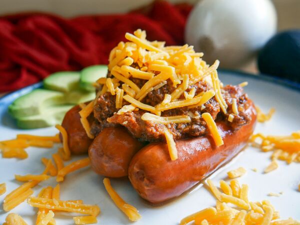 chili dogs made with True Primal Beef Chili and cheese