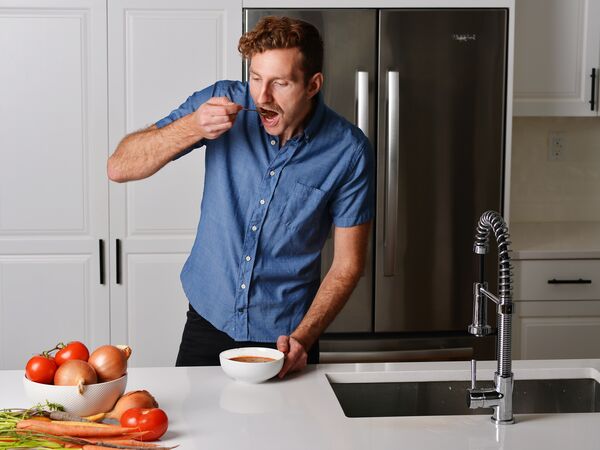 man eating soup