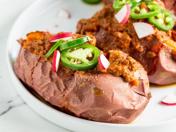 sweet potatoes stuffed with True Primal Beef Chili and jalapenos