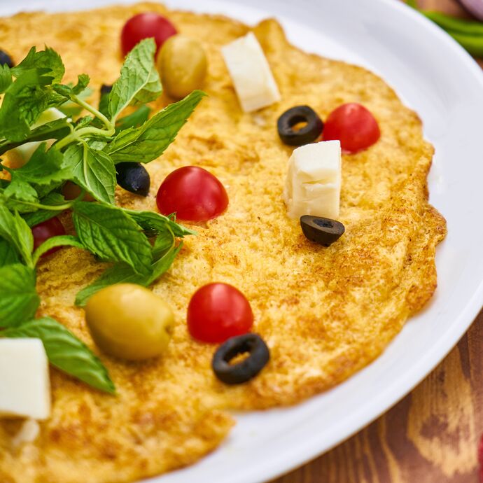 omelet on plate with vegetables