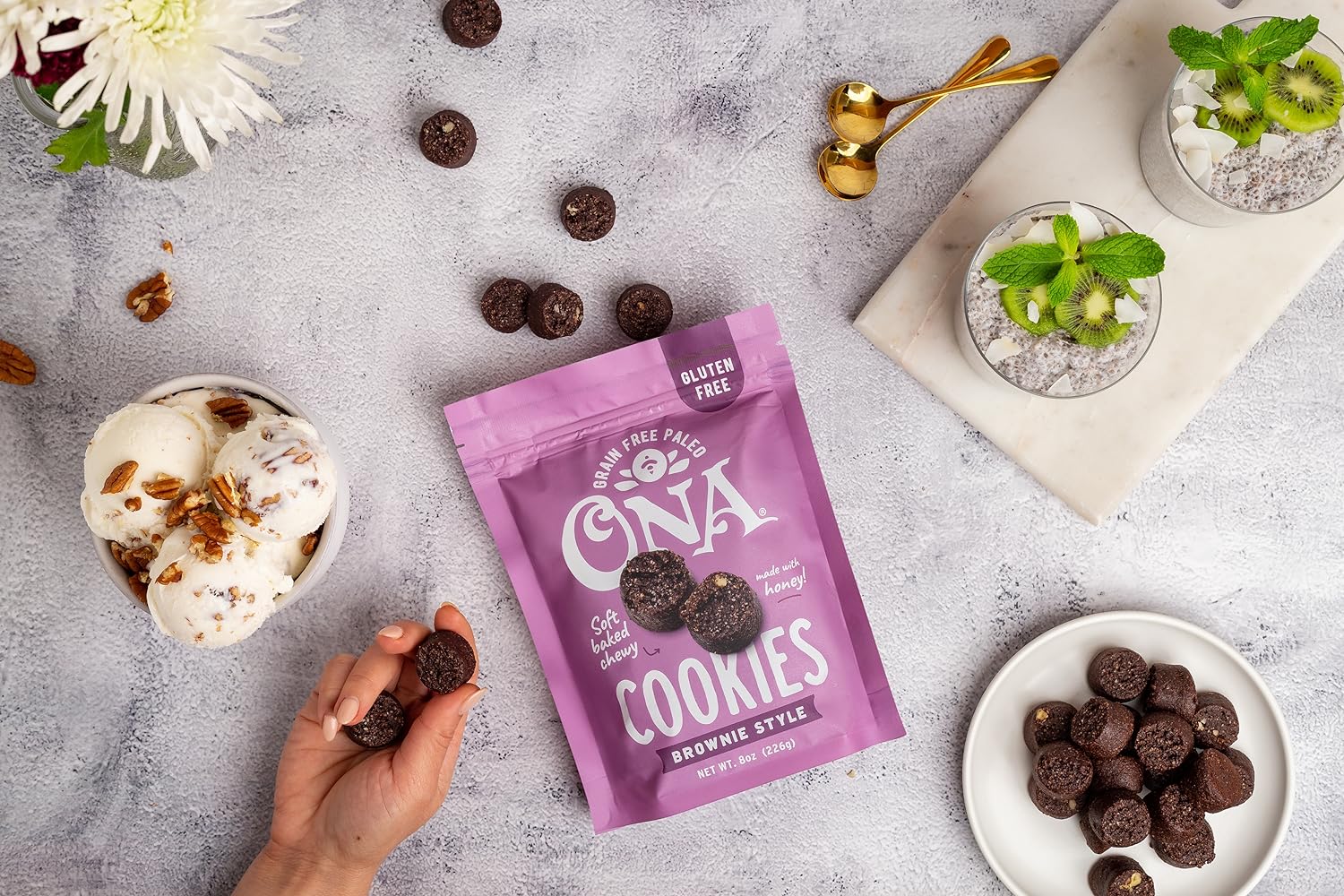 Ona Brownie Style Cookies in pouch and on a plate with ice cream and pudding