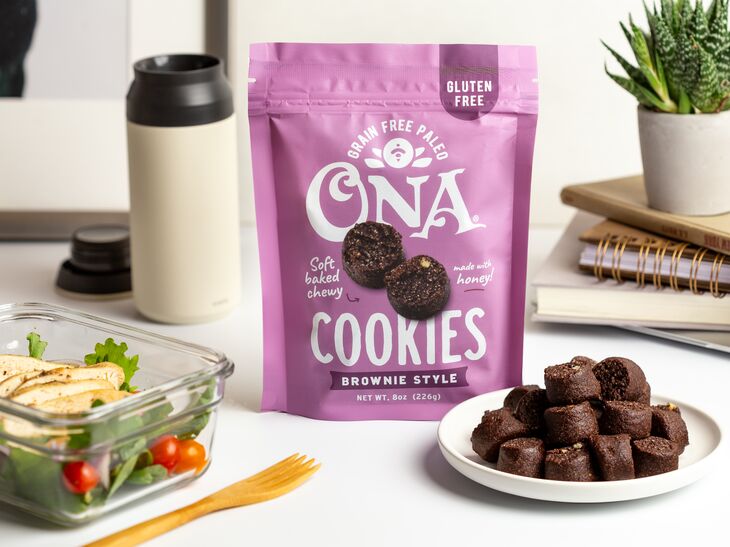 Ona Brownie Style Cookies on a plate, in a pouch, and next to a salad
