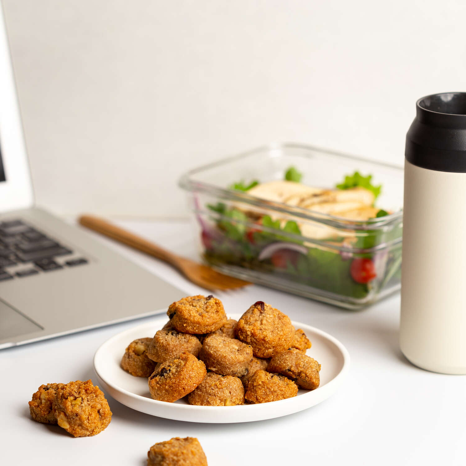 Ona Cinnamon Raisin Cookies on a plate with salad lunch at work