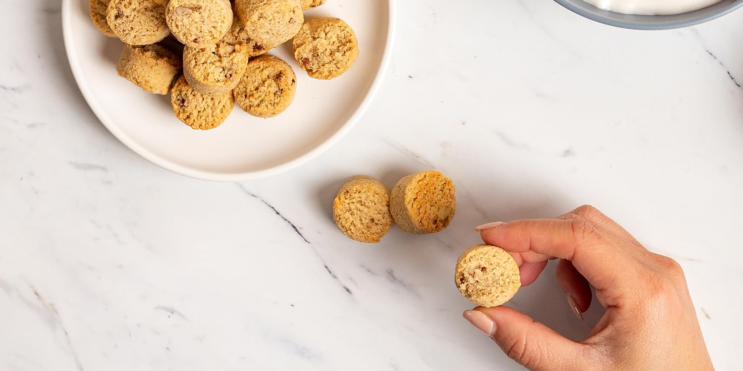 grabbing Ona cookies from a plate