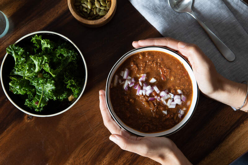 bowl of chili and kale salad